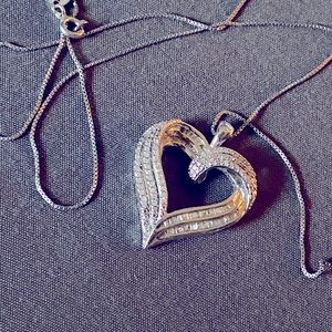 Diamond and cubic zirconia heart necklace.